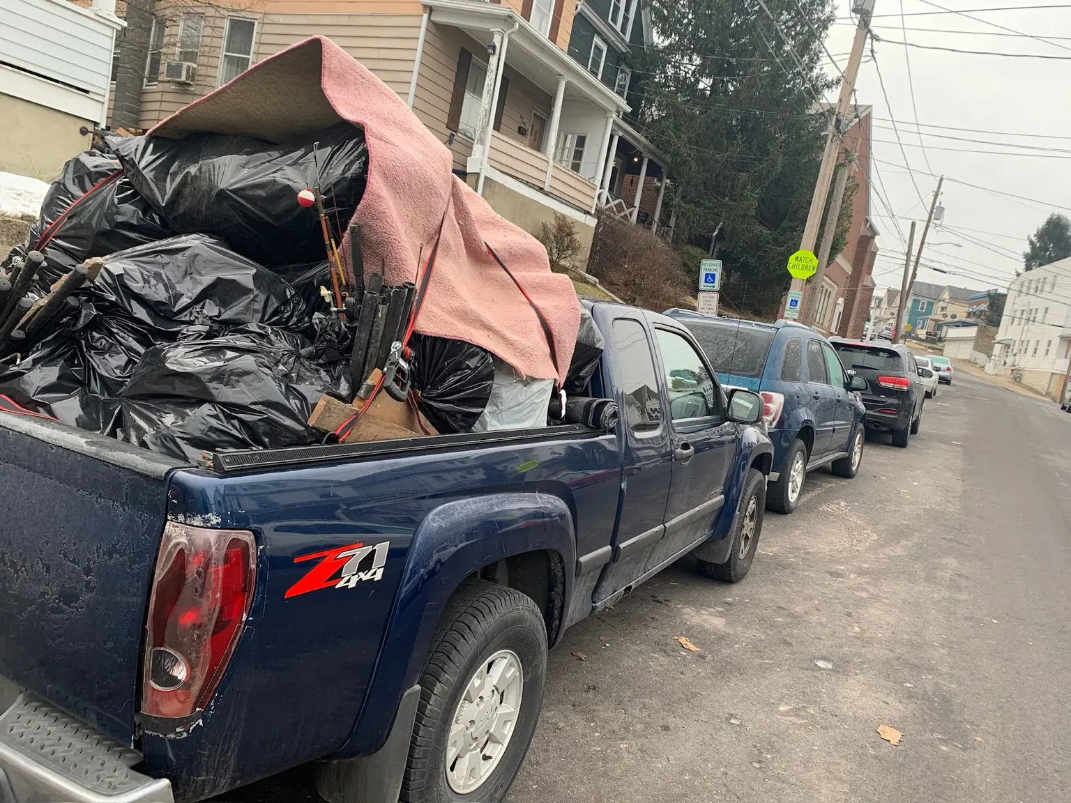 Pickup truck loaded with bags and household items