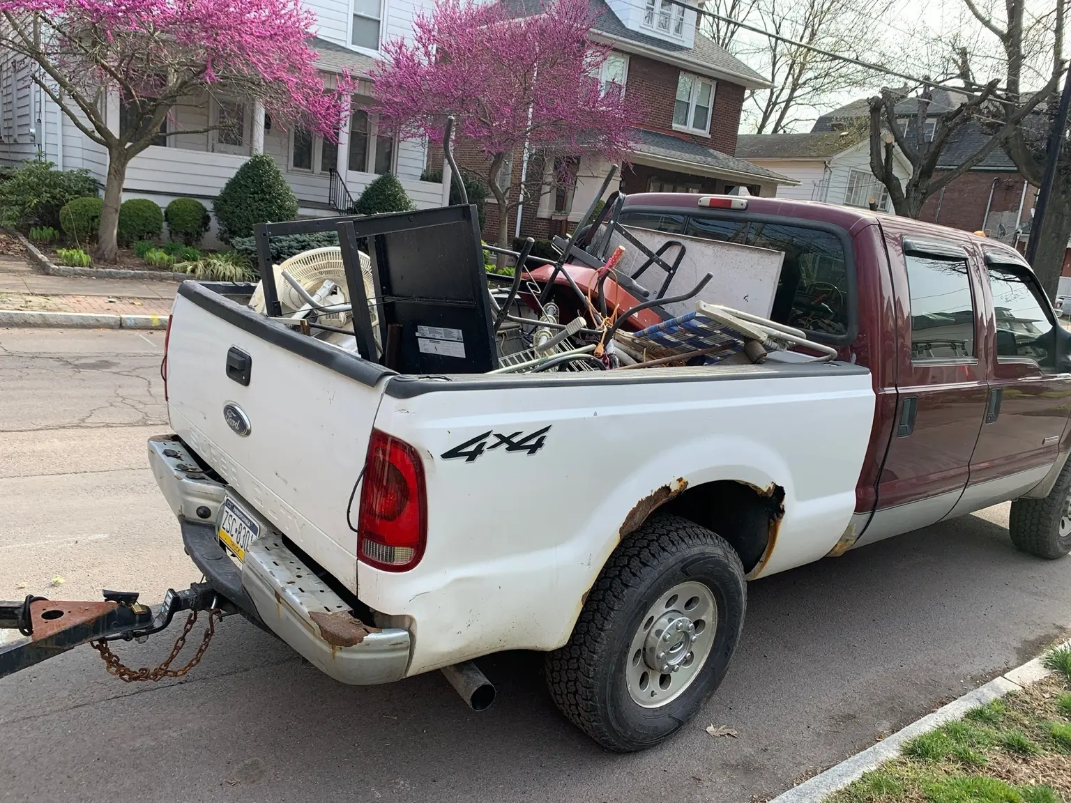 Pickup truck loaded with metal furniture and household items