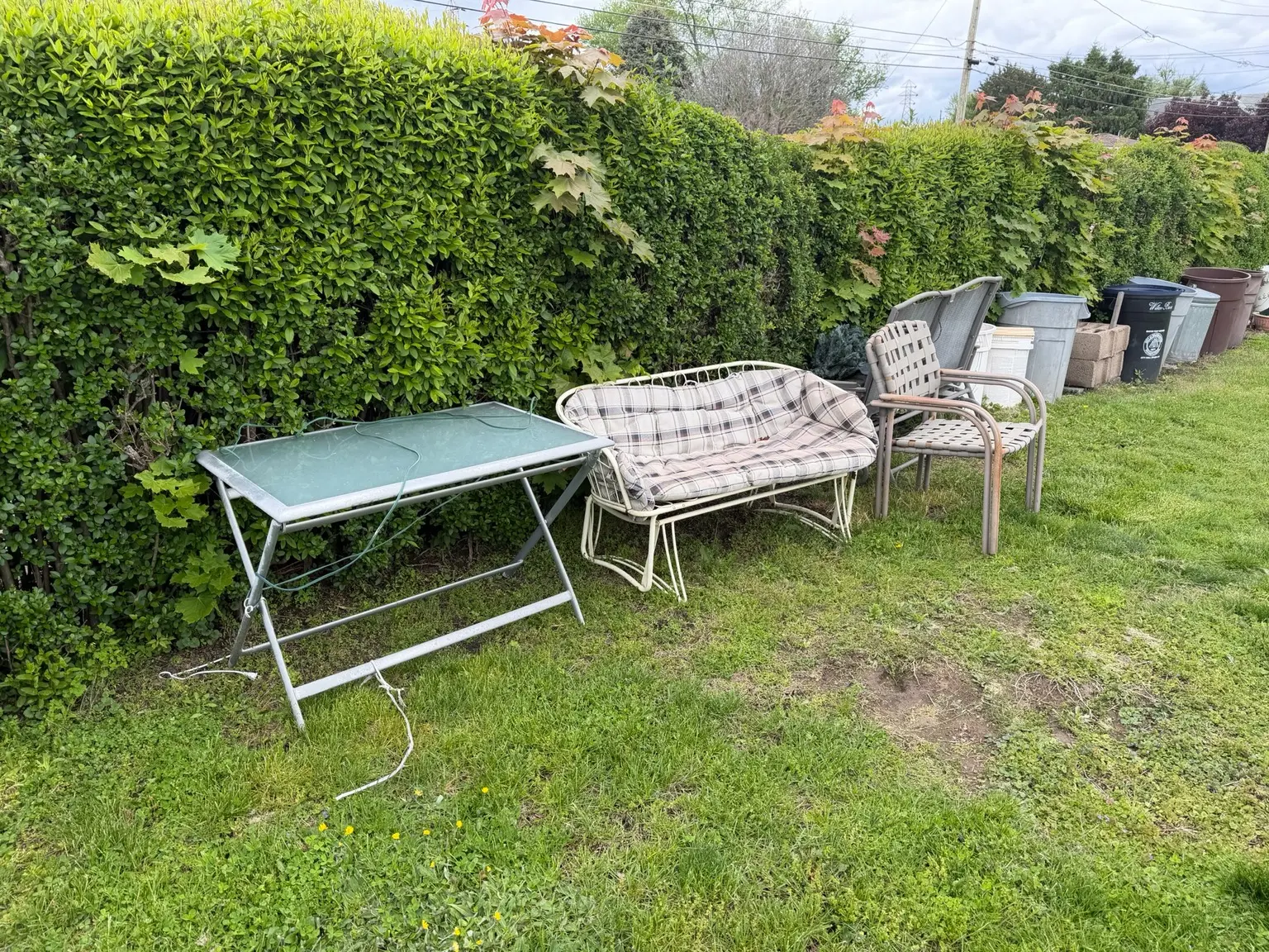 Patio furniture and outdoor items ready for removal
