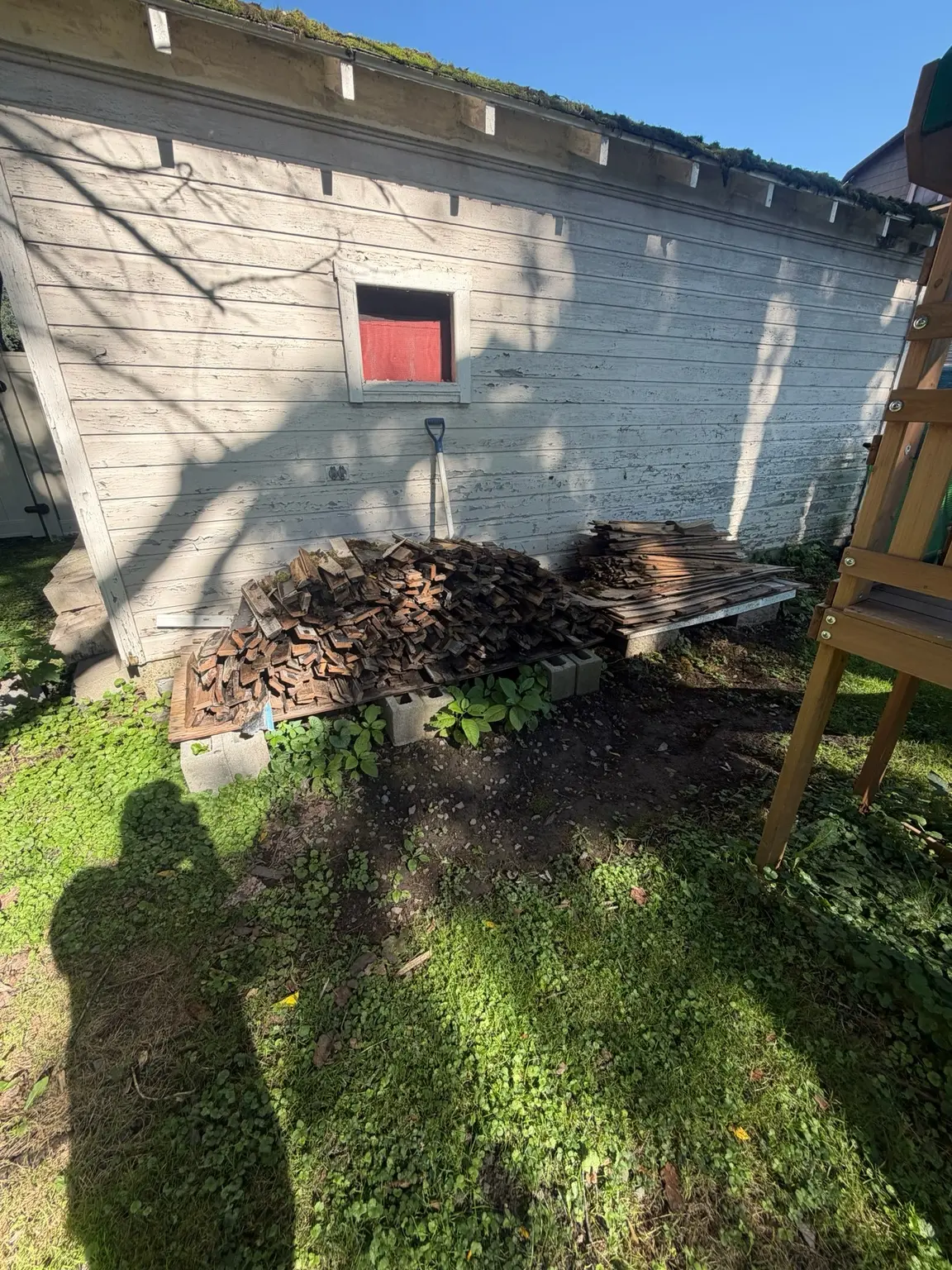 Large amount of removed wood flooring stacked for loading