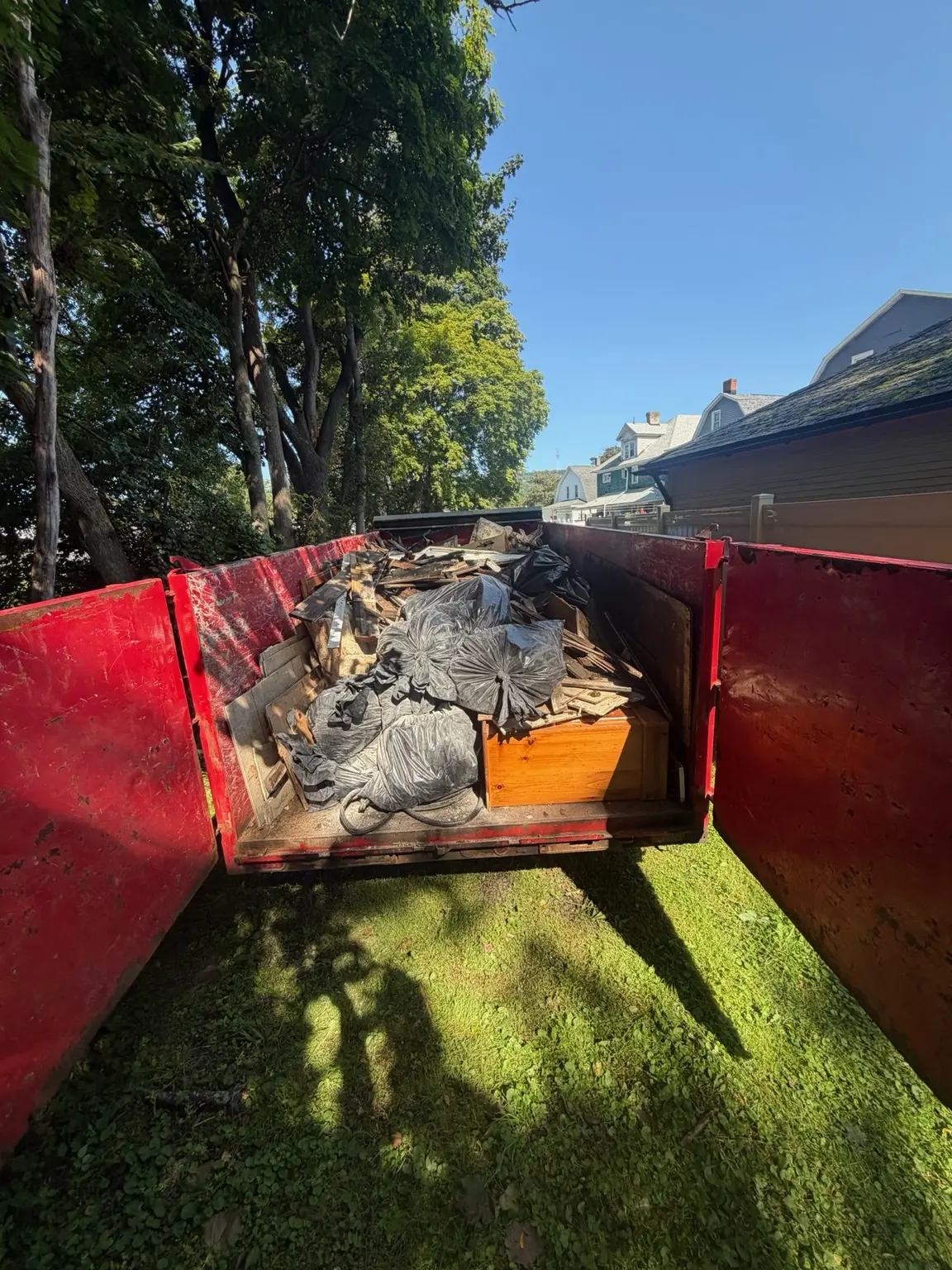 Trailer loaded with old flooring and renovation debris