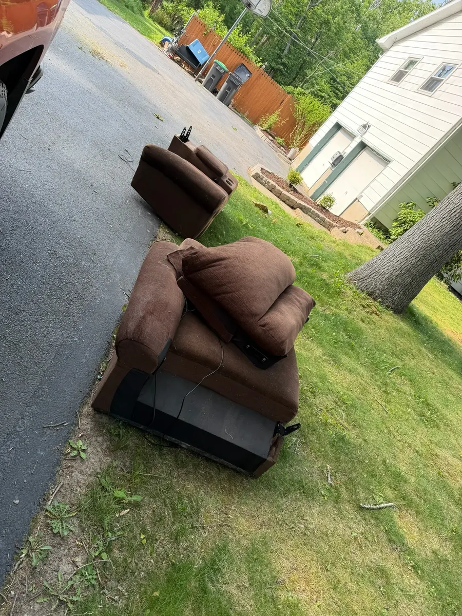 Brown couch at the pickup location before removal